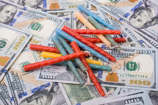 Birthday candles is placed on spread US dollar banknotes