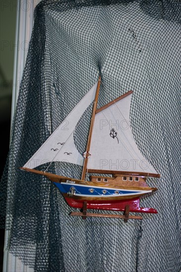 Mini size little colorful model sailboat in view