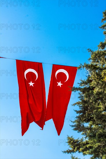 Turkish national flag hang in view in open air