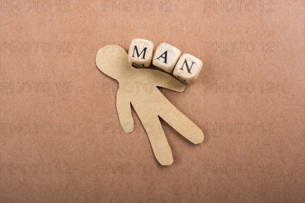 Paper man and man wording with letter cubes on paper