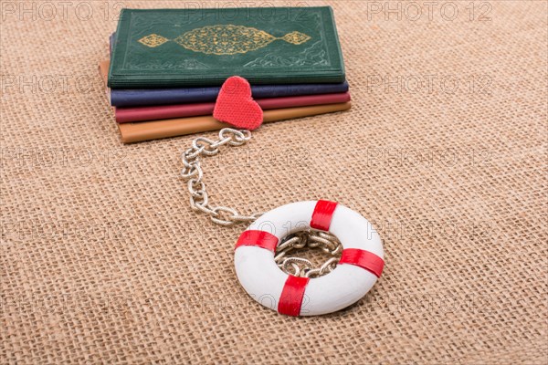 Little books attached to a life saver with a chain