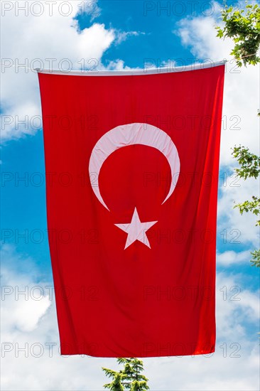 Turkish national flag hang in view in open air