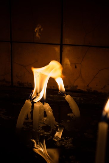 Burning candles with candle light in the dark