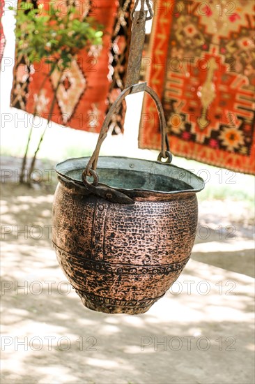 Selling old metal cookware in bazaar