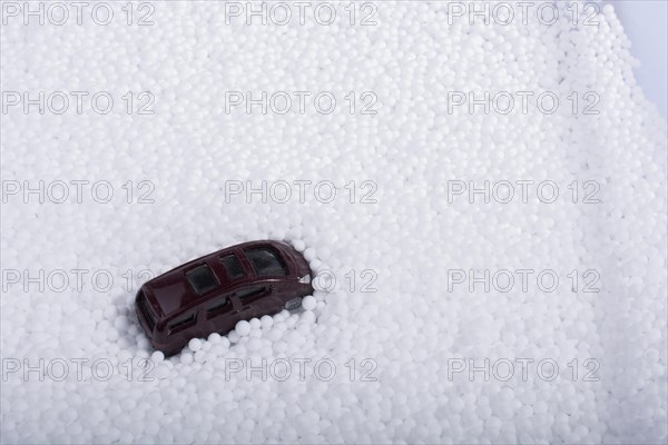 Model car on little white polystyrene foam balls