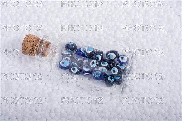 Turkish evil eye beads on white polystyrene foam balls