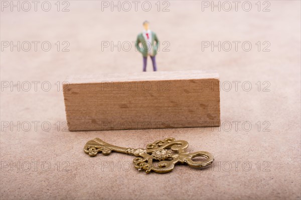 Figurine standing behind retro styled key