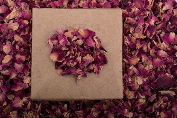 Dried rose petals in box and as a background