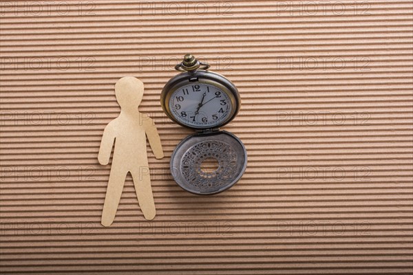 Man shape cut out of paper in hand in the view