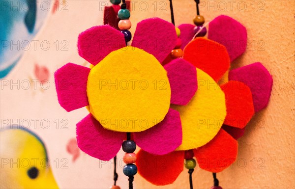 Fake flowers placed on brown background