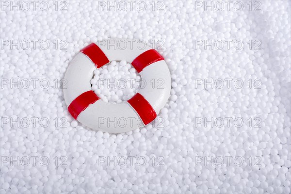 Lifesaver on little white polystyrene foam balls