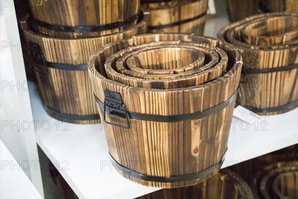 Old retro style wooden buckets for sale in bazaar