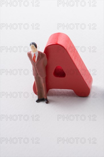 Man figurine and Letters of abc of alphabet on white