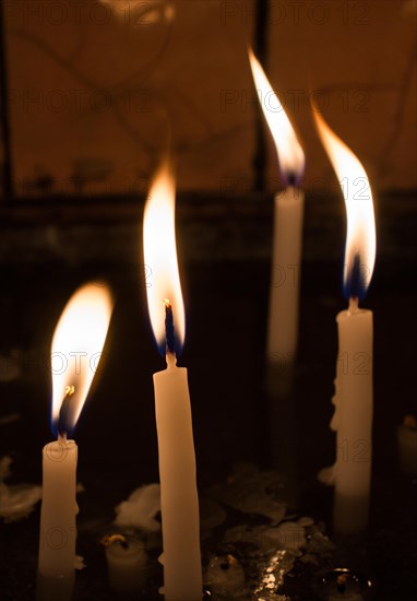 Burning candles with candle light in the dark