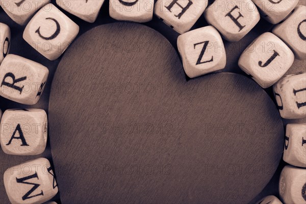 Red Love icon and Letter cubes of made of wood