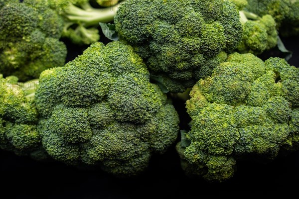 Fresh Broccoli in a pile at supermarket. Fresh and ripe broccoli background
