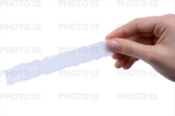 Hand holding a piece of blank torn notepaper