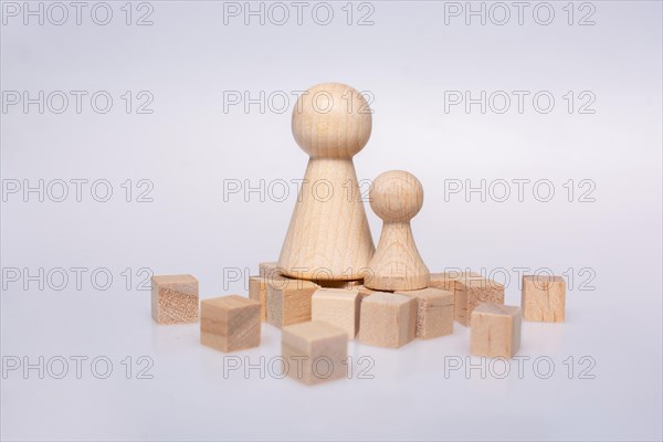 Wooden figurines of family as concept of caring for children