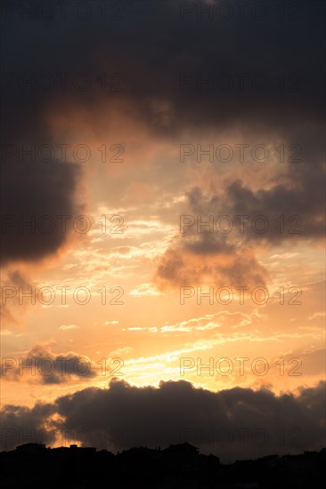 Dark and grey clouds are in the sky