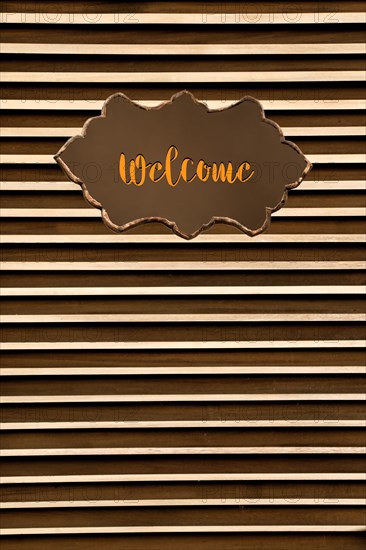Welcome wording on sign board on background for business concept