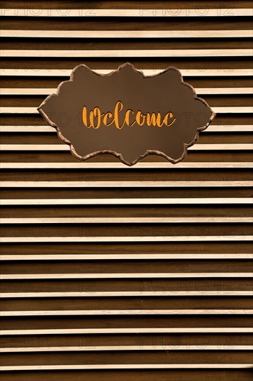 Welcome wording on sign board on background for business concept
