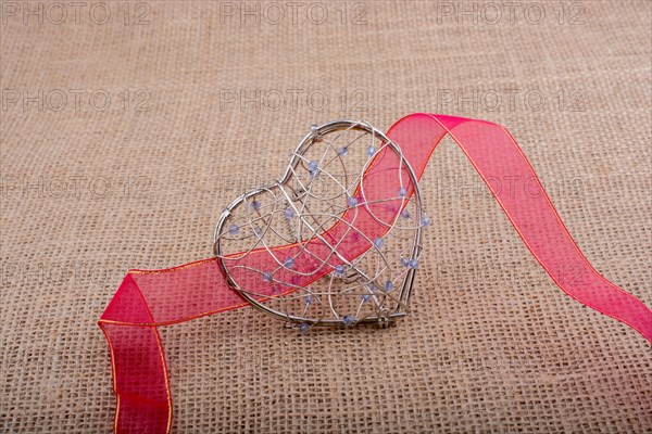 Band and Heart shaped cage on linen canvas