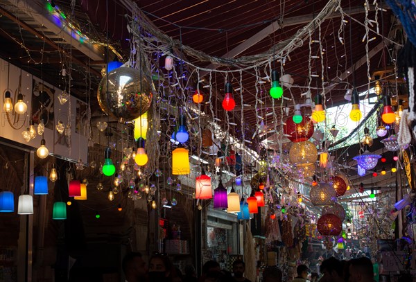 Colorful luminaires in outdoors hanging from a string