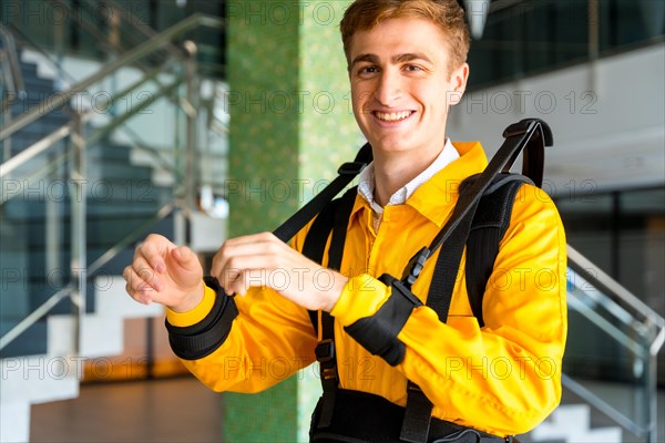 Portrait of an employee with an exoskeleton from a futuristic high-tech warehouse