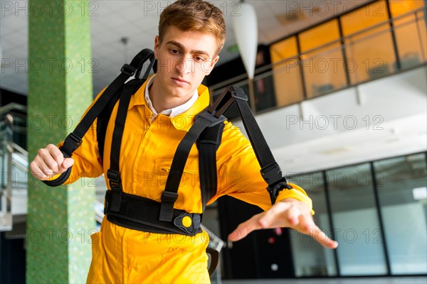 Employee with an exoskeleton from a futuristic high-tech warehouse