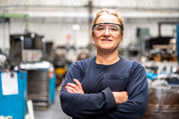 Portrait of factory worker operator working in numerical control sector