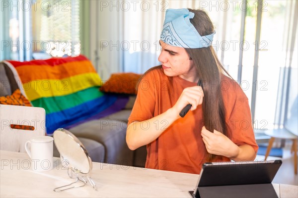 Daily morning routine for a gay man sitting and combing his long hair