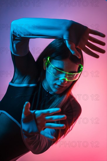 Futuristic studio portrait with neon lights of a transgender person in a Virtual futuristic world