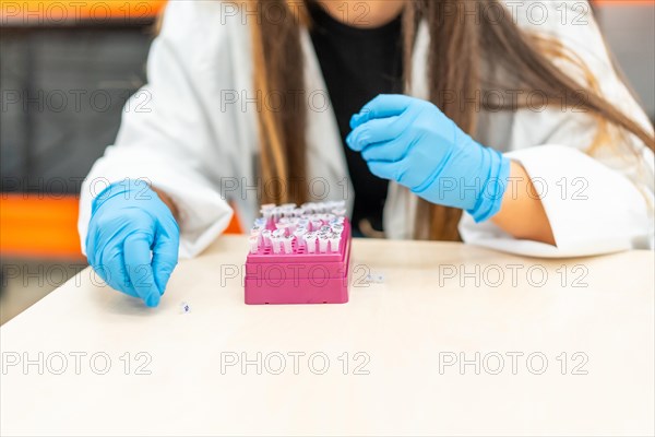 Close-up of the hands of an Unrecognizable woman working with samples in a laboratory