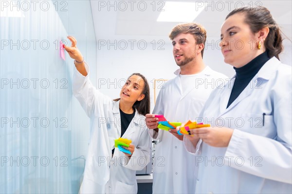Scientist during a brainstorm creative process in a cancer research lab