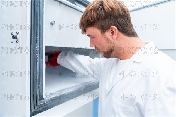 Close-up of a male scientist freezing samples in a cancer research laboratory