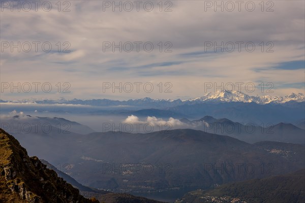 Aerial View over a Beautiful Mountainscape and And Snow Capped Monte Rosa and Mountain Peak Matterhorn and with Floating Clouds in a Sunny Day in Ticino