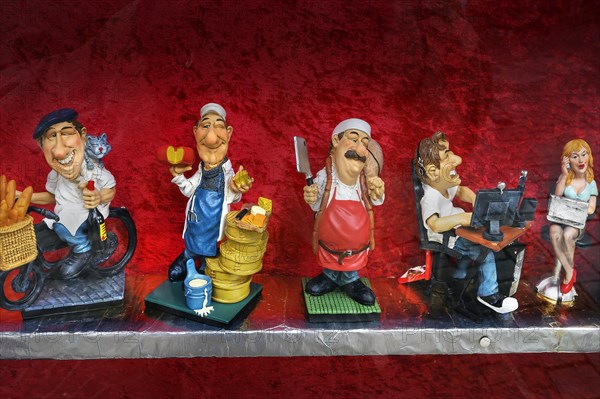 Funny ceramic figurines with different professions