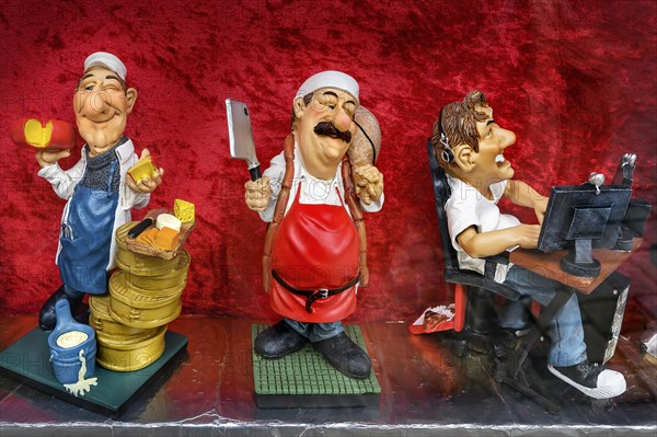 Funny ceramic figurines with different professions