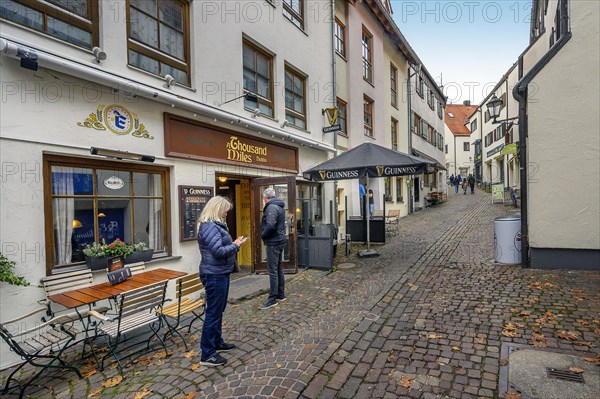 Narrow alley with Irish Pub