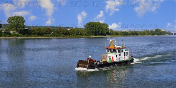 Inspection ship navigating on the Rhine River near Mainz