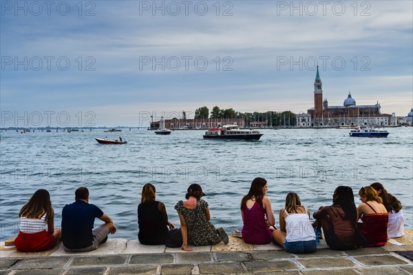 Tourists on quay wall