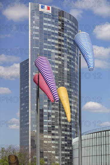 Office tower with colourful windsocks in front of it