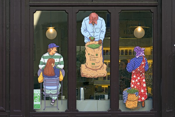 Advertising images on the window of a tea shop