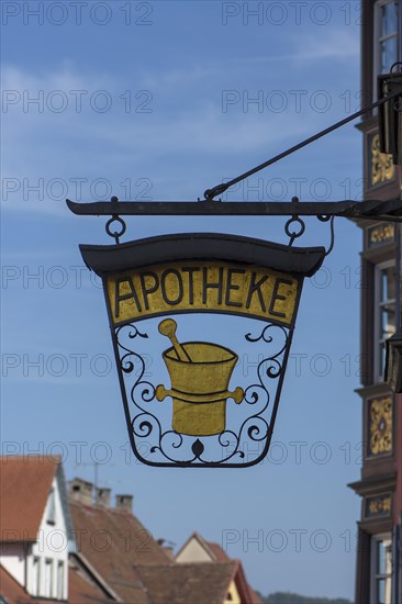Historic nose plate with a mortar at a pharmacy