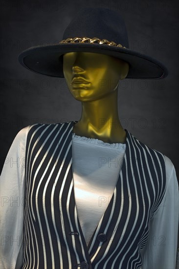 Mannequin with hat in a fashion shop