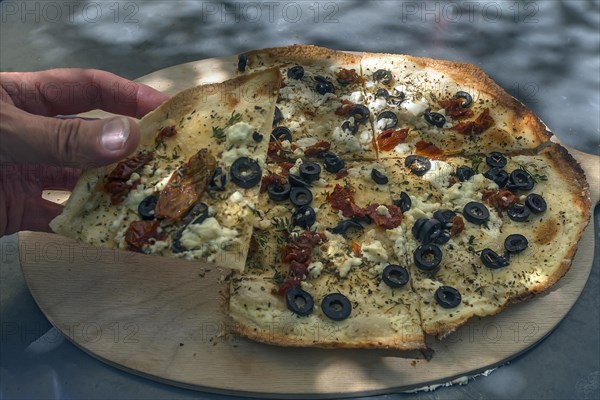 Tarte flambee with sun-dried tomatoes