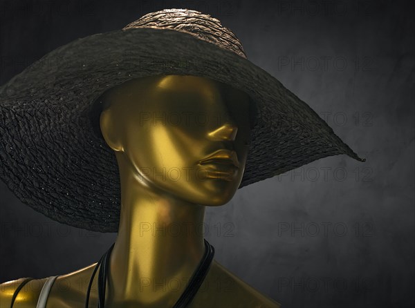 Mannequin with hat in a fashion shop