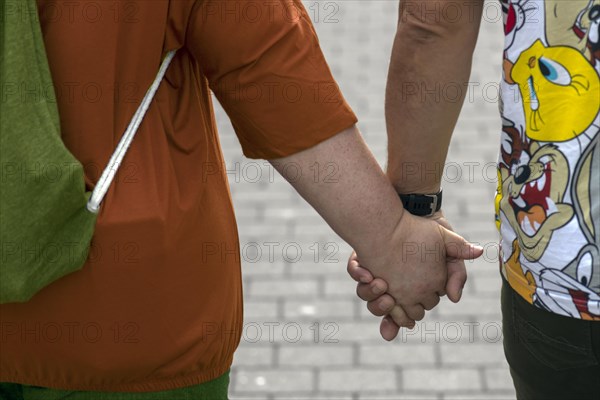 Couple walking hand in hand