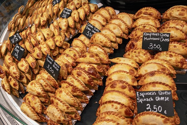 Empanadas displayed at La Boqueria market