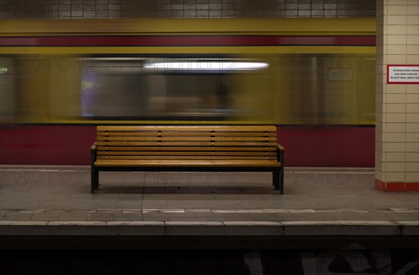 Empty bench and departing S-Bahn train at Nordbahnhof